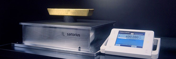 Scale weighing a gold bar