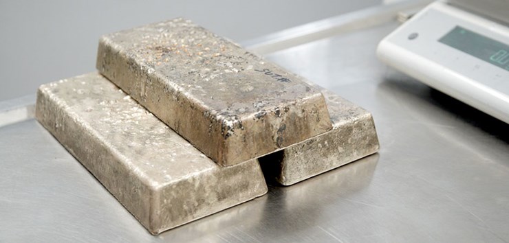 Three alloy bars stacked and waiting to be tested
