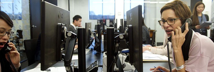 Taking phone calls at the 24 hour trading desk