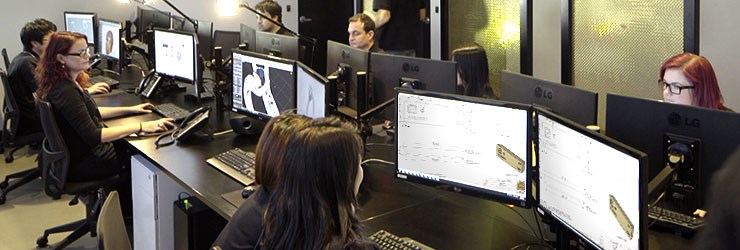 Employees working on the custom design process in an office setting